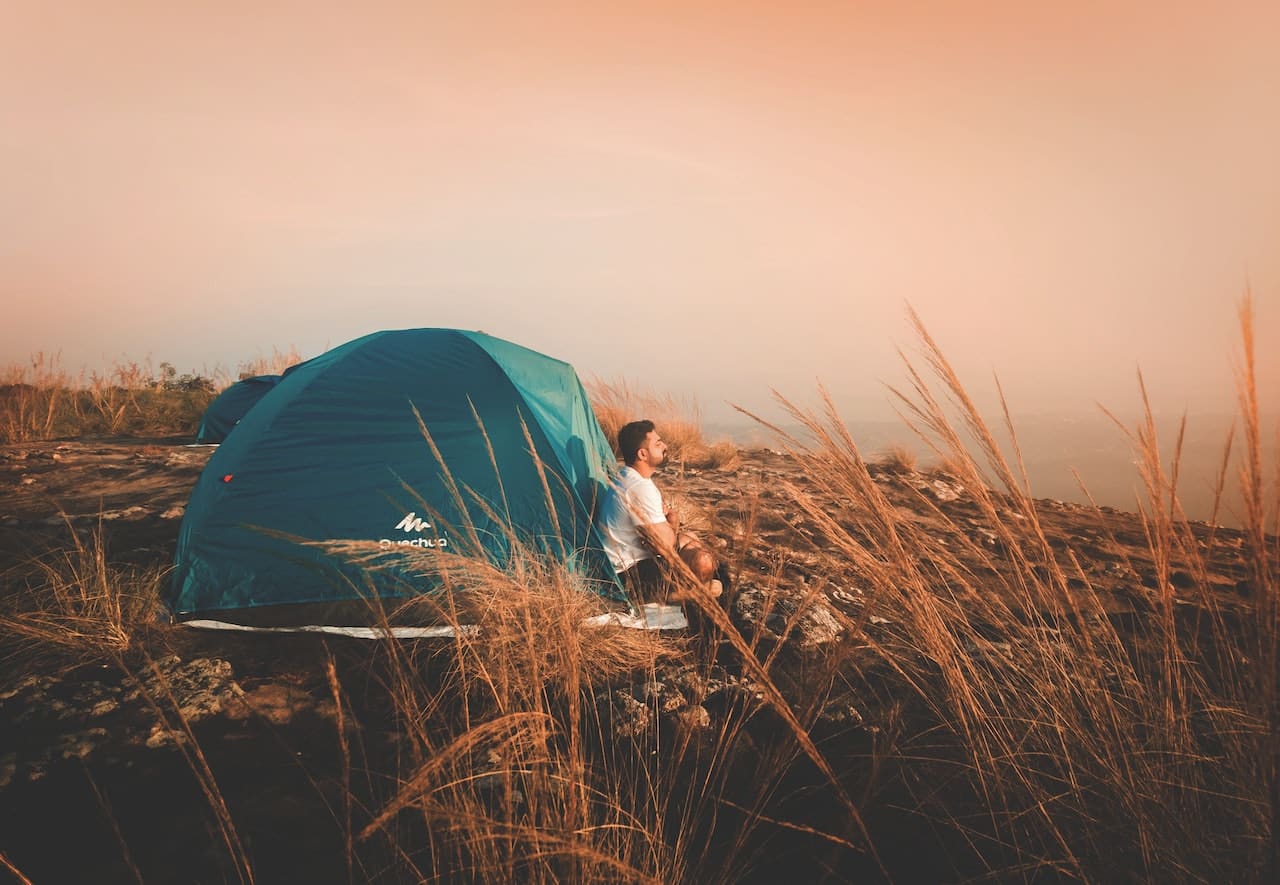 solo travel backpacker in tent
